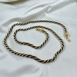 Vintage roped Trifari black and gold plated necklace in near mint condition.